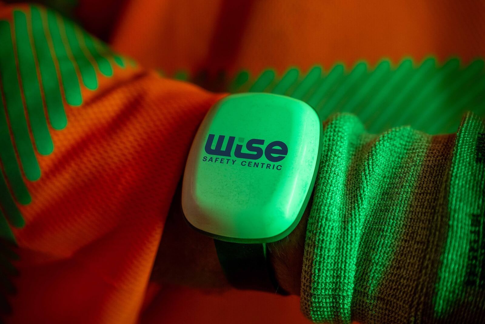 WISE badge worn on a worker's wrist
